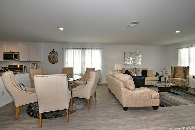 10746 Margarita Loop, Converse, TX 78109 - dining room featuring light wood-type flooring and recessed lighting