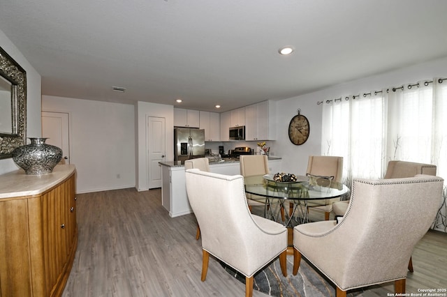 10746 Margarita Loop, Converse, TX 78109 - dining area with light wood-style flooring and recessed lighting