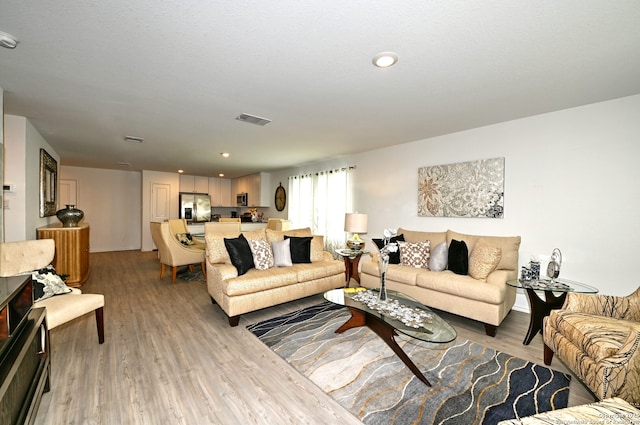 10746 Margarita Loop, Converse, TX 78109 - living area featuring light wood finished floors and recessed lighting