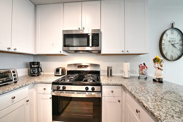 10746 Margarita Loop, Converse, TX 78109 - kitchen featuring stainless steel appliances, white cabinets, and light stone counters