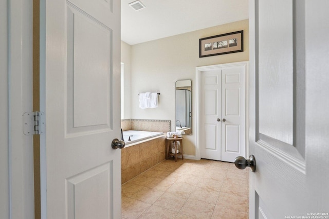 3403 Navajo Peace, San Antonio, TX 78261 - bathroom with tile patterned floors and a bath
