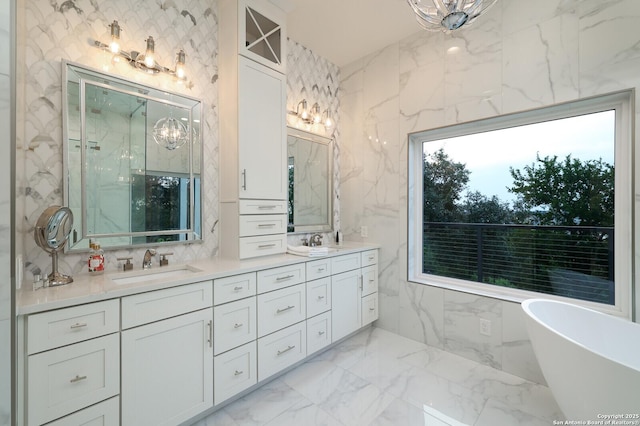 19727 La Sierra Blvd, San Antonio, TX 78256 - full bath featuring double vanity, a freestanding tub, marble tiled floors, a marble finish shower, and a chandelier