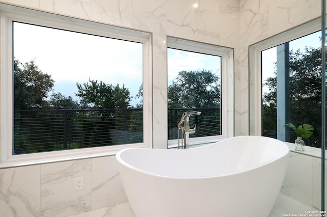19727 La Sierra Blvd, San Antonio, TX 78256 - bathroom featuring marble tiled flooring and a freestanding tub