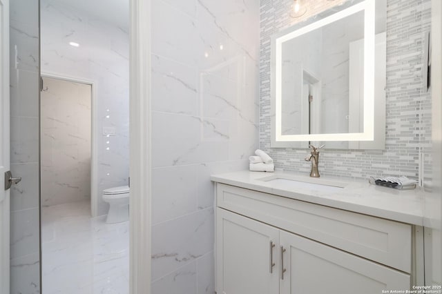 19727 La Sierra Blvd, San Antonio, TX 78256 - bathroom featuring vanity, tile walls, marble finish floors, and tasteful backsplash