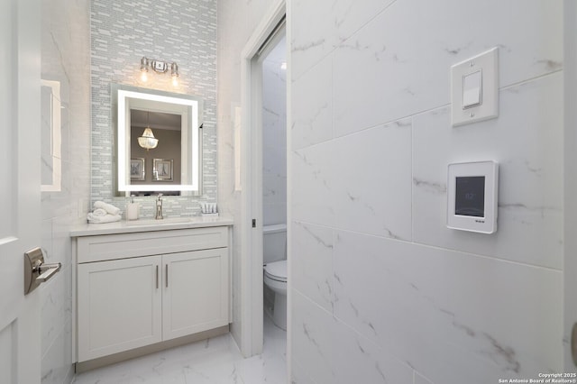 19727 La Sierra Blvd, San Antonio, TX 78256 - bathroom featuring marble finish flooring, vanity, and backsplash