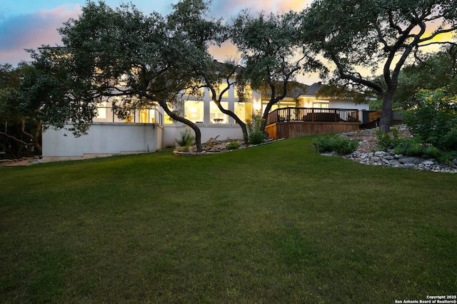 19727 La Sierra Blvd, San Antonio, TX 78256 - yard at dusk featuring a lawn and a deck