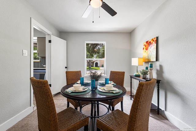 112 Meadow Way, Converse, TX 78109 - dining space with carpet floors, a ceiling fan, and a textured wall