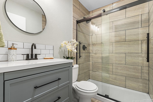 112 Meadow Way, Converse, TX 78109 - bathroom featuring vanity, a stall shower, and a textured wall