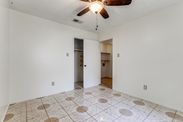 8658 Quail Whisper, San Antonio, TX 78250 - unfurnished bedroom featuring a closet, light tile patterned floors, and ceiling fan