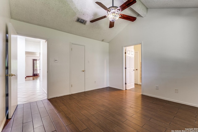 8658 Quail Whisper, San Antonio, TX 78250 - empty room with ceiling fan, dark wood-style flooring, and a textured ceiling