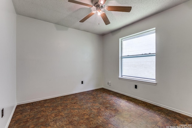 8658 Quail Whisper, San Antonio, TX 78250 - empty room with a textured ceiling, a ceiling fan, and stone finish flooring