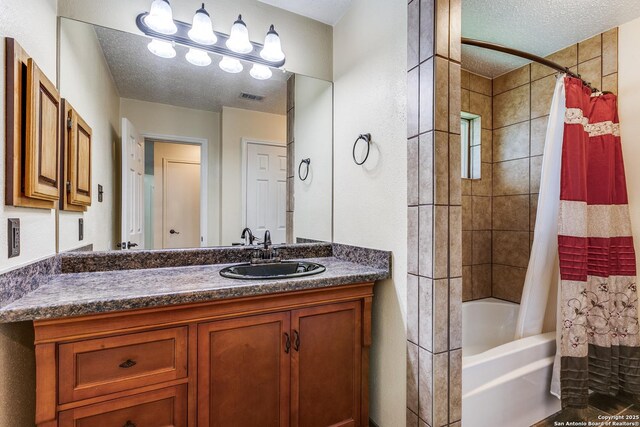 8658 Quail Whisper, San Antonio, TX 78250 - bathroom with vanity, shower / bath combo, and a textured ceiling