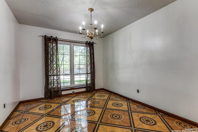 8658 Quail Whisper, San Antonio, TX 78250 - unfurnished room with a chandelier, tile patterned floors, and a textured ceiling