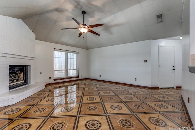8658 Quail Whisper, San Antonio, TX 78250 - unfurnished living room featuring tile patterned floors, ceiling fan, a brick fireplace, and high vaulted ceiling