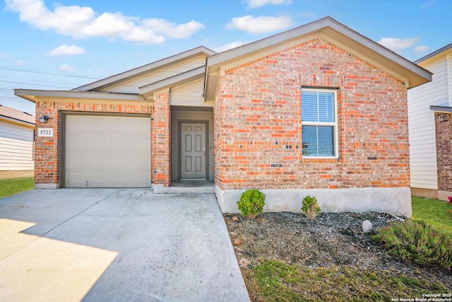 5722 Tanquil Cv, Converse, TX 78109 - view of front of property with concrete driveway, brick siding, and a garage