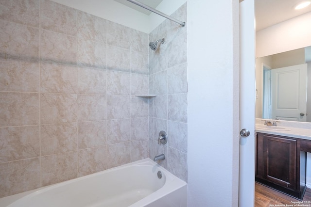 5722 Tanquil Cv, Converse, TX 78109 - full bathroom featuring shower / bathtub combination, vanity, and wood finished floors