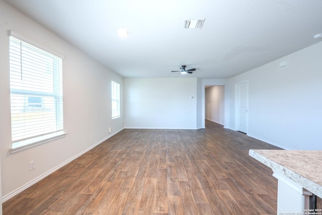 5722 Tanquil Cv, Converse, TX 78109 - spare room with dark wood-type flooring, ceiling fan, and a smoke detector