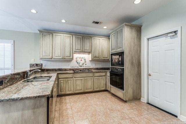 2430 Trace Oak, San Antonio, TX 78232 - kitchen featuring black appliances, stone countertops, recessed lighting, light tile patterned flooring, and a peninsula