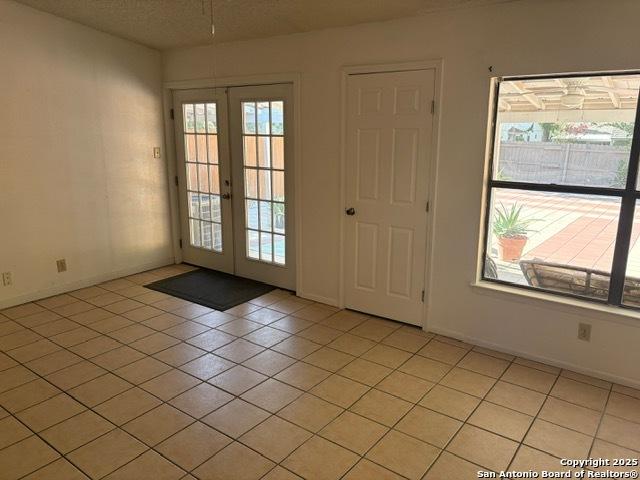 9931 Birch Fld, San Antonio, TX 78245 - entryway featuring french doors and light tile patterned floors