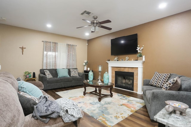 13111 Burgundy Pt, San Antonio, TX 78217 - living room featuring wood finished floors, a ceiling fan, a fireplace, and recessed lighting