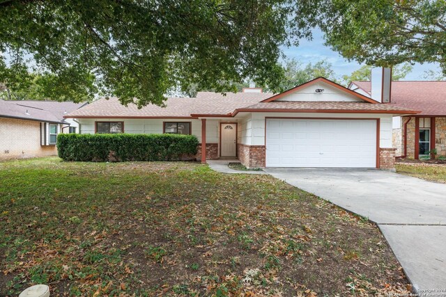 9238 Ridge Wilde, San Antonio, TX 78250 - ranch-style home featuring a garage, brick siding, concrete driveway, and a chimney