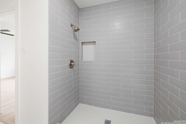 9238 Ridge Wilde, San Antonio, TX 78250 - full bathroom featuring tiled shower