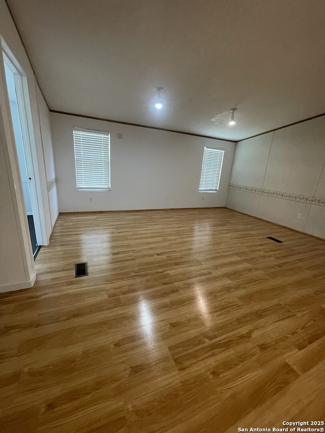 207 S Edwards, Charlotte, TX 78011 - unfurnished bedroom with light wood-style flooring