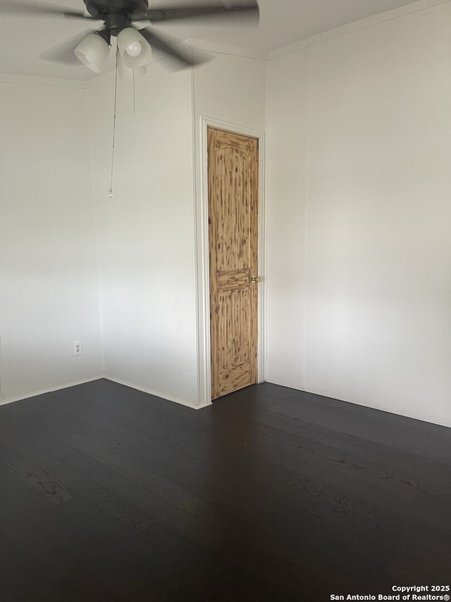 207 S Edwards, Charlotte, TX 78011 - unfurnished room featuring dark wood-style flooring and a ceiling fan