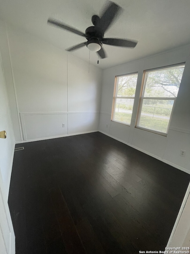 207 S Edwards, Charlotte, TX 78011 - spare room with dark wood-style flooring and ceiling fan