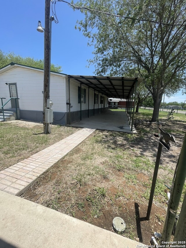 207 S Edwards, Charlotte, TX 78011 - view of property exterior with a carport
