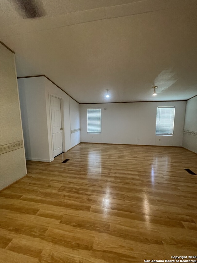 207 S Edwards, Charlotte, TX 78011 - empty room featuring light wood finished floors and plenty of natural light