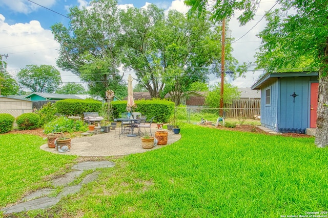 323 Hatcher Ave, San Antonio, TX 78223 - fenced backyard with a patio area and an outdoor structure