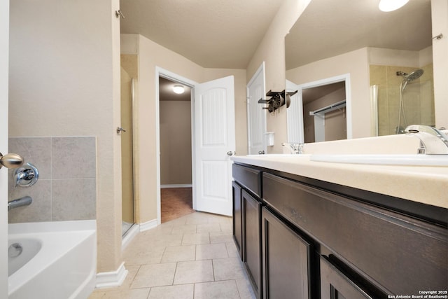 15442 Cooks Petrel, San Antonio, TX 78253 - full bath featuring a shower stall, a garden tub, vanity, tile patterned floors, and a spacious closet