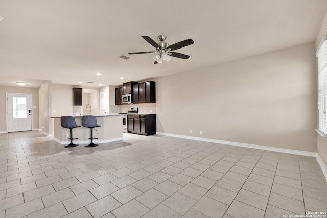 15442 Cooks Petrel, San Antonio, TX 78253 - unfurnished living room with a ceiling fan, light tile patterned floors, and recessed lighting