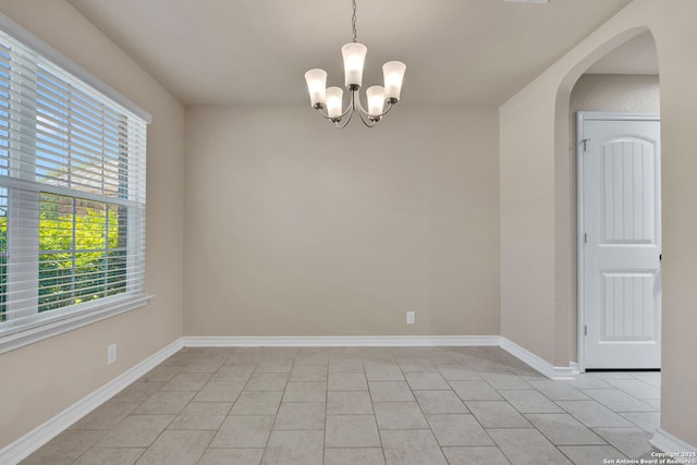 15442 Cooks Petrel, San Antonio, TX 78253 - unfurnished room with a chandelier, light tile patterned floors, and arched walkways