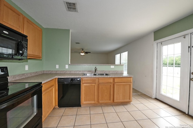 245 Gatewood, Cibolo, TX 78108 - kitchen featuring black appliances, a peninsula, ceiling fan, light countertops, and light tile patterned flooring