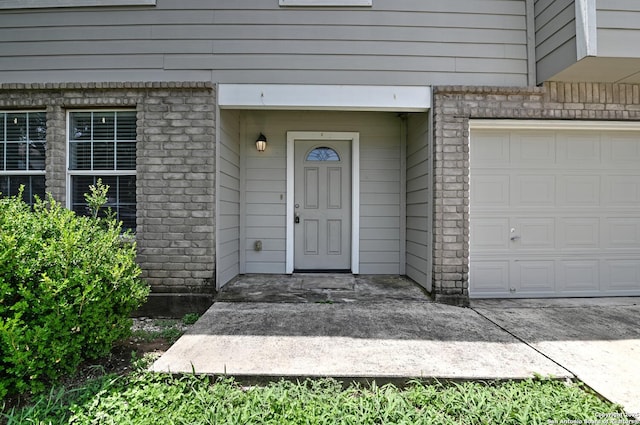 245 Gatewood, Cibolo, TX 78108 - entrance to property with a garage and brick siding