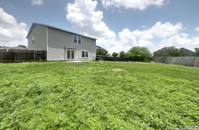 245 Gatewood, Cibolo, TX 78108 - rear view of house with french doors and a fenced backyard