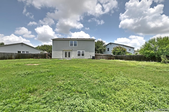 245 Gatewood, Cibolo, TX 78108 - back of house with french doors and a fenced backyard