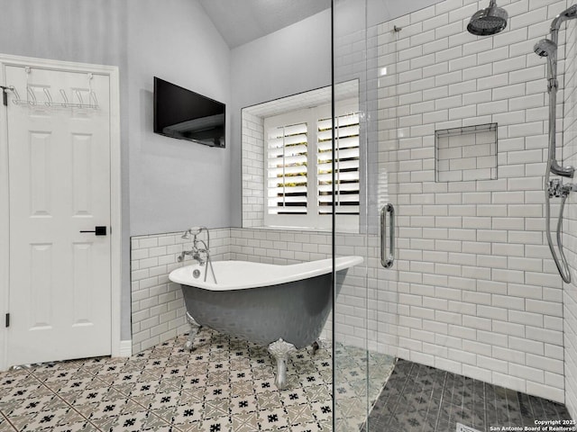 7 Greens Whisper, San Antonio, TX 78216 - full bathroom with tile walls, a stall shower, a freestanding tub, tile patterned floors, and a wainscoted wall