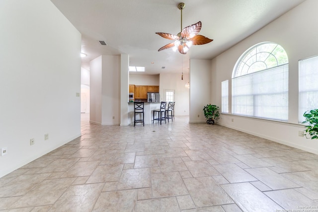 15311 Tamaron Pass, San Antonio, TX 78253 - living room featuring ceiling fan and light stone finish floors