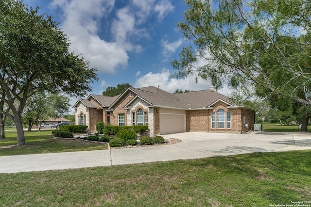 15311 Tamaron Pass, San Antonio, TX 78253 - ranch-style house featuring brick siding, a garage, driveway, and a front yard