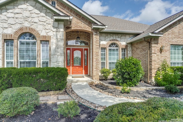 15311 Tamaron Pass, San Antonio, TX 78253 - entrance to property featuring stone siding, brick siding, and roof with shingles