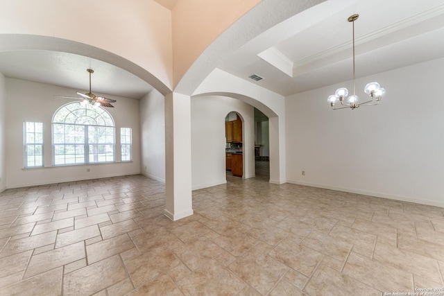 15311 Tamaron Pass, San Antonio, TX 78253 - empty room featuring ceiling fan, a chandelier, arched walkways, and light stone finish floors