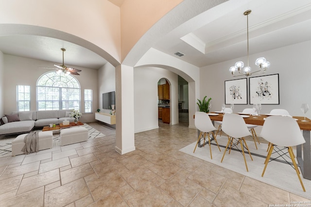 15311 Tamaron Pass, San Antonio, TX 78253 - dining space featuring ceiling fan, arched walkways, a chandelier, and light stone finish floors
