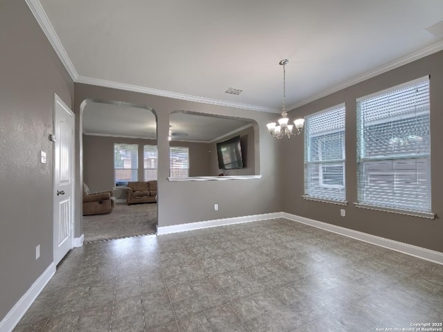 7566 Copper Cv, Converse, TX 78109 - empty room with crown molding, a chandelier, and arched walkways