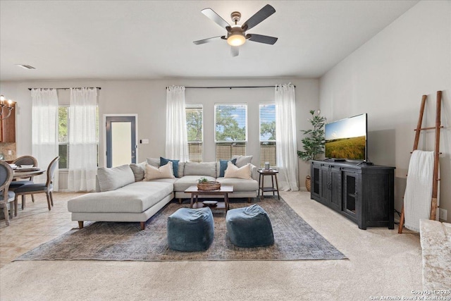 25702 Coleus, San Antonio, TX 78261 - living area with plenty of natural light, a ceiling fan, a chandelier, and light carpet