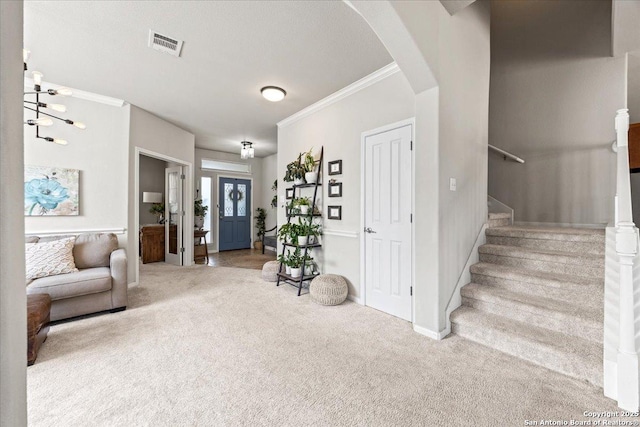 25702 Coleus, San Antonio, TX 78261 - entrance foyer with ornamental molding, carpet floors, stairs, and arched walkways