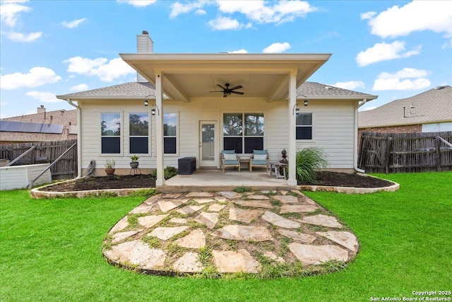 25702 Coleus, San Antonio, TX 78261 - back of property with ceiling fan, a patio, a fenced backyard, and a chimney