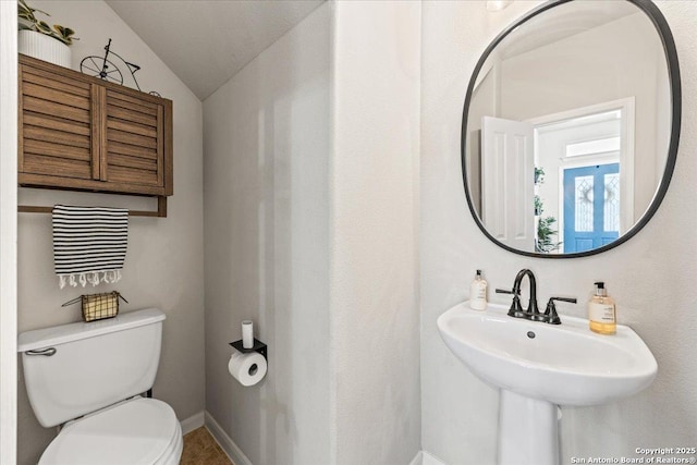 25702 Coleus, San Antonio, TX 78261 - bathroom featuring toilet and vaulted ceiling